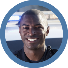 An image of a male uniformed officer smiling